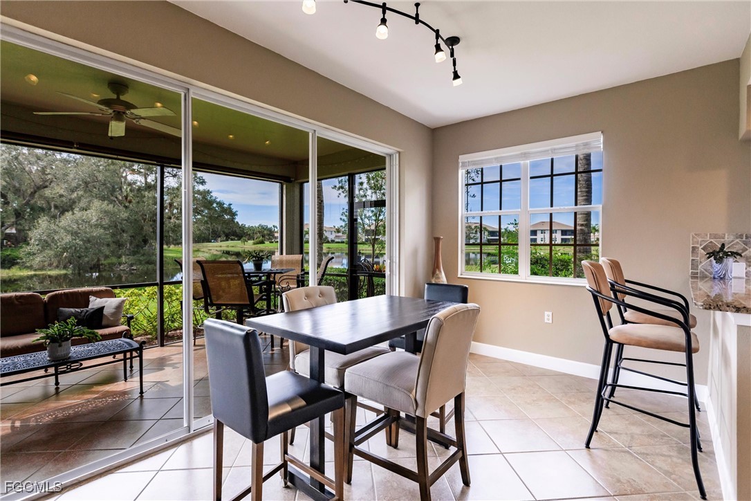 13120 Pebblebrook Point Circle, Unit 102 Fort Myers, FL 33905 - Photo 20 of 50 a dining room with furniture window and outside view