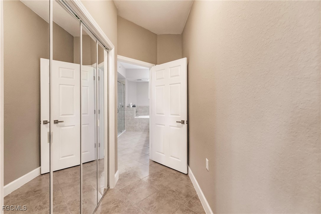 13120 Pebblebrook Point Circle, Unit 102 Fort Myers, FL 33905 - Photo 28 of 50 a view of a bathroom with a shower