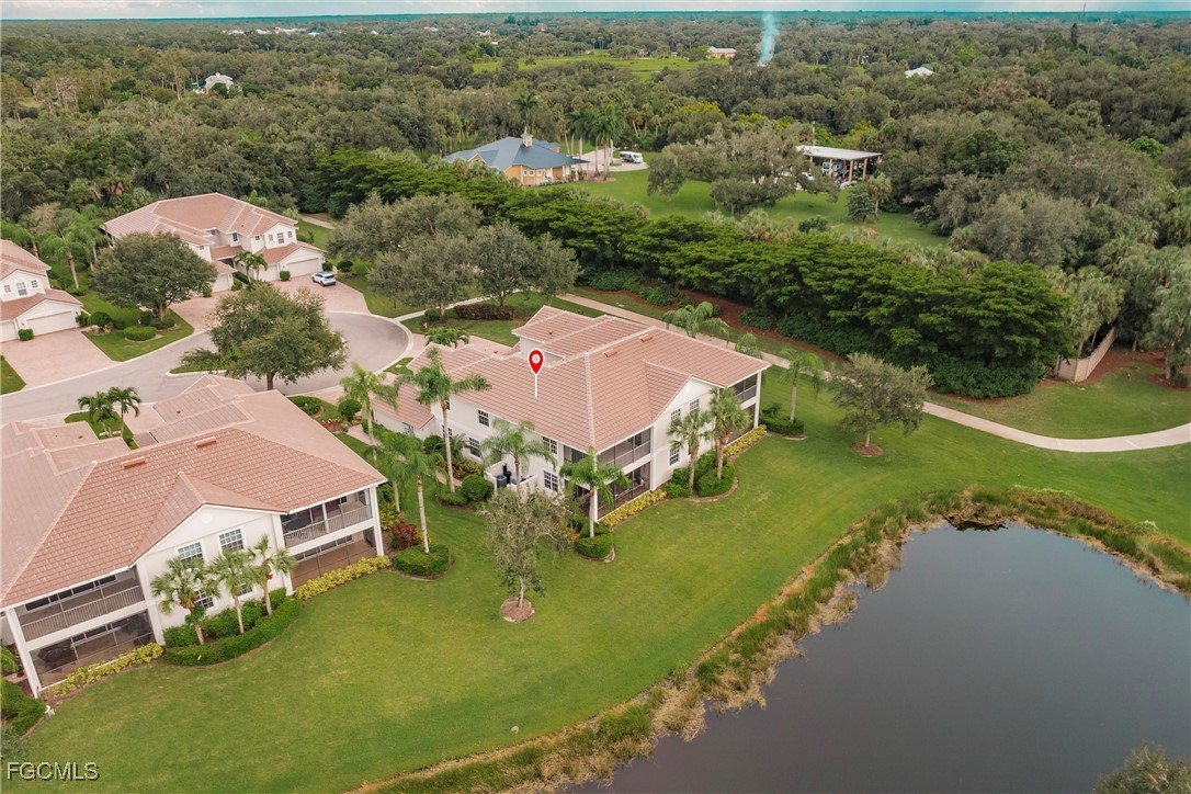 13120 Pebblebrook Point Circle, Unit 102 Fort Myers, FL 33905 - Photo 3 of 50 an aerial view of a house with a garden