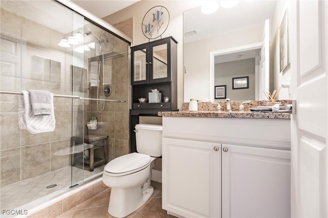 13120 Pebblebrook Point Circle, Unit 102 Fort Myers, FL 33905 - Photo 36 of 50 a bathroom with a sink a toilet and shower