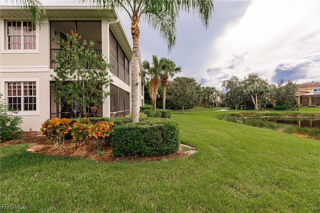 13120 Pebblebrook Point Circle, Unit 102 Fort Myers, FL 33905 - Photo 42 of 50 a view of a house with a yard