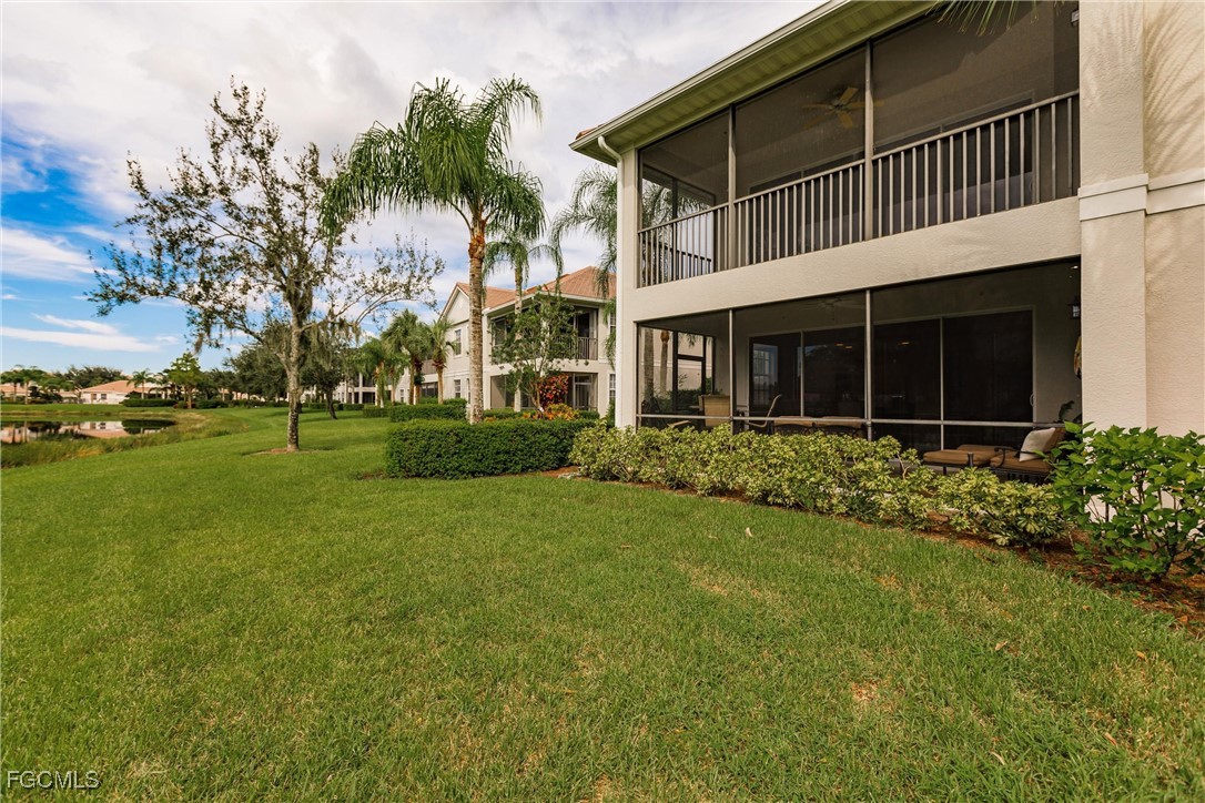 13120 Pebblebrook Point Circle, Unit 102 Fort Myers, FL 33905 - Photo 43 of 50 front view of a house with a yard