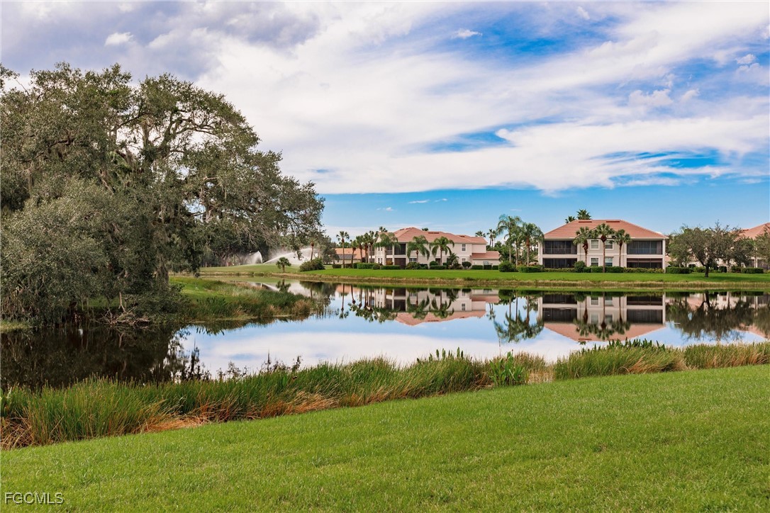 13120 Pebblebrook Point Circle, Unit 102 Fort Myers, FL 33905 - Photo 45 of 50 a view of a lake with houses in back