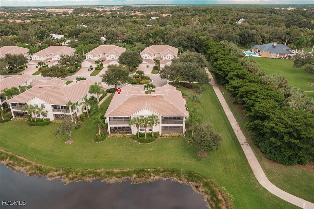 13120 Pebblebrook Point Circle, Unit 102 Fort Myers, FL 33905 - Photo 46 of 50 an aerial view of residential houses with outdoor space