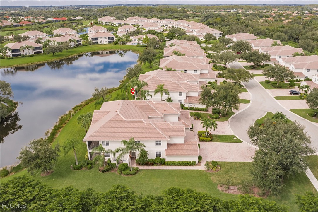 13120 Pebblebrook Point Circle, Unit 102 Fort Myers, FL 33905 - Photo 47 of 50 an aerial view of residential houses with outdoor space