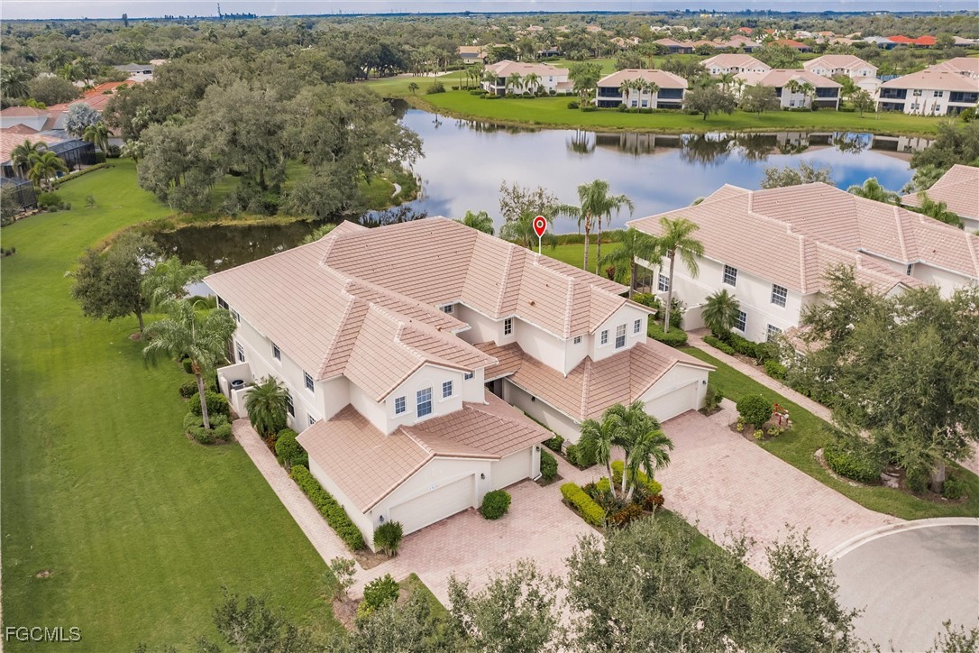13120 Pebblebrook Point Circle, Unit 102 Fort Myers, FL 33905 - Photo 48 of 50 an aerial view of a house with a lake view