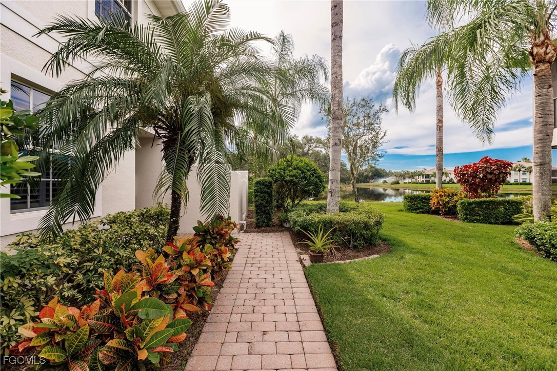 13120 Pebblebrook Point Circle, Unit 102 Fort Myers, FL 33905 - Photo 5 of 50 a view of a backyard with potted plants and large trees