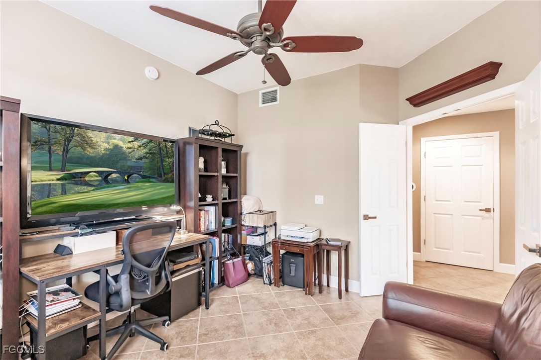 13120 Pebblebrook Point Circle, Unit 102 Fort Myers, FL 33905 - Photo 7 of 50 a living room with patio furniture and a open kitchen view