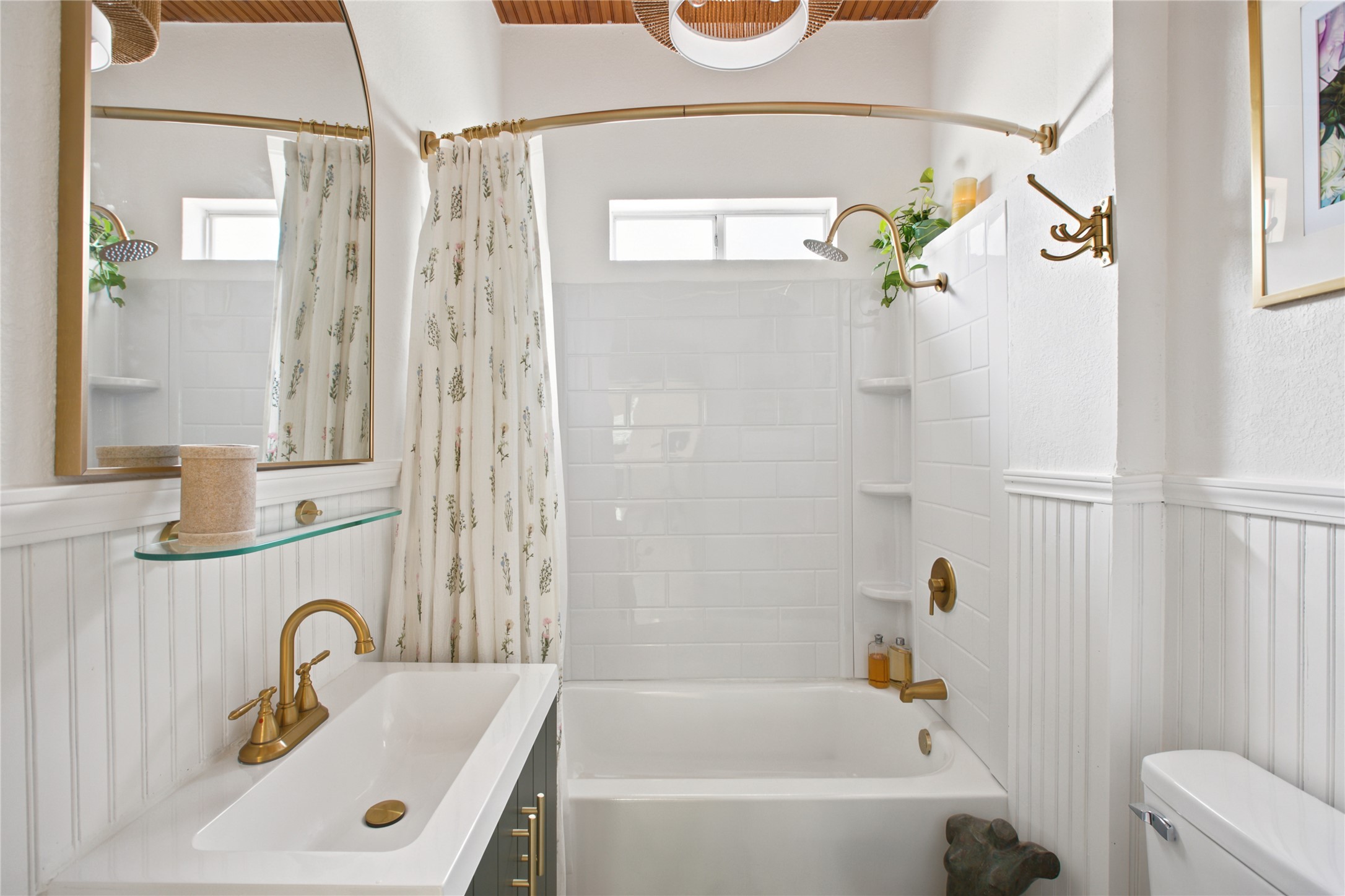 372 Old Lockhart Road Lockhart, TX 78644 - Photo 22 of 40 A pristine bathroom features a crisp white vanity, a tiled bath with a shower, and updated fixtures.