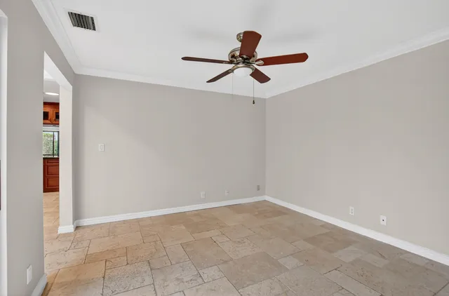 a view of room with ceiling fan