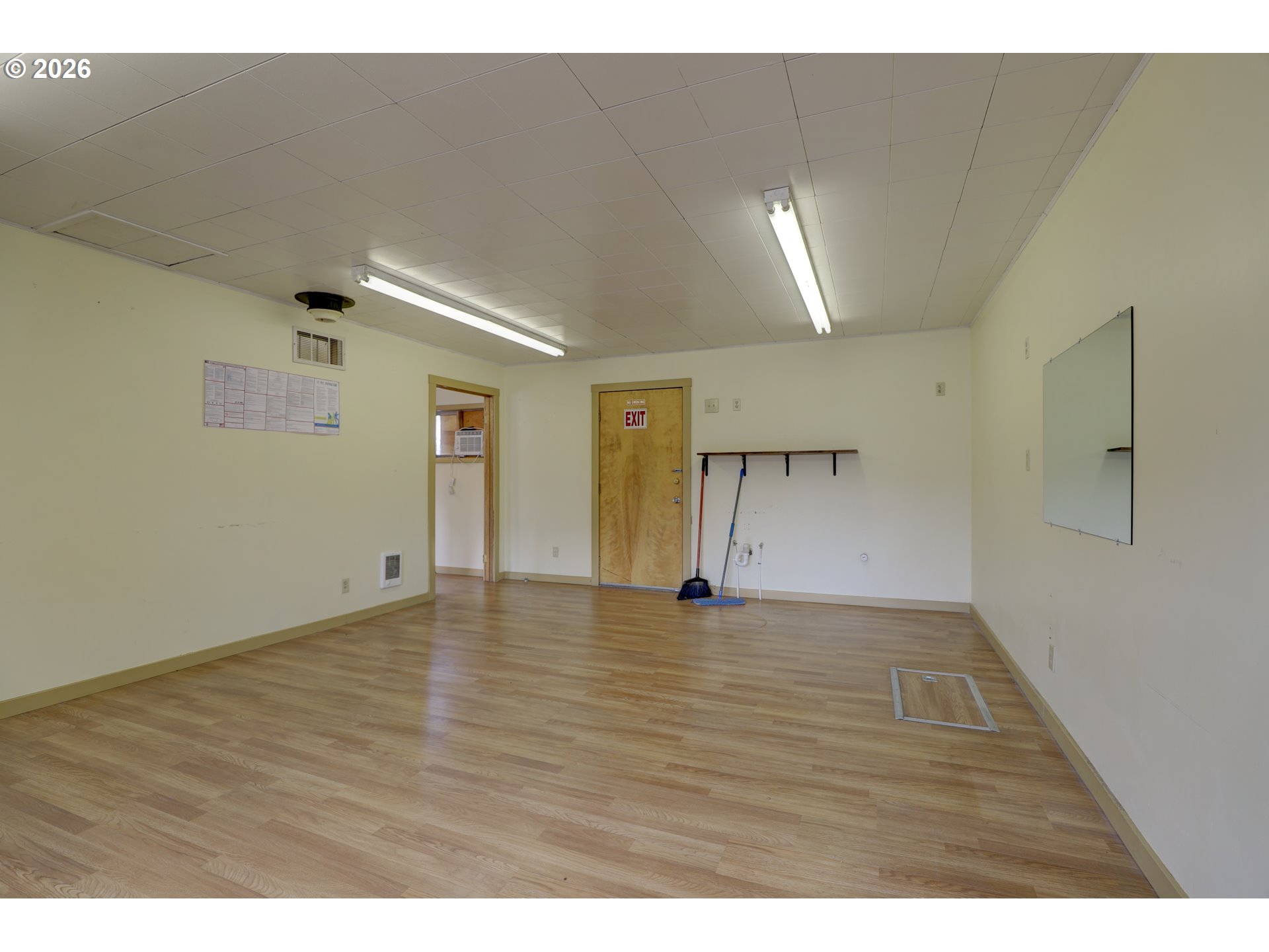 1013 Clark Street Wasco, OR 97065 - Photo 11 of 19 a view of an empty room with window and wooden floor