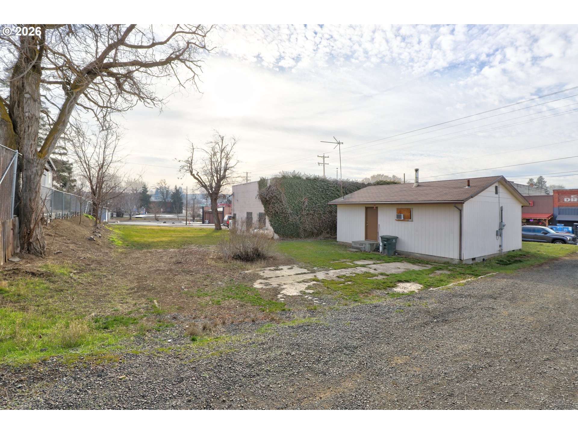 1013 Clark Street Wasco, OR 97065 - Photo 4 of 19 a view of a house with backyard and a tree