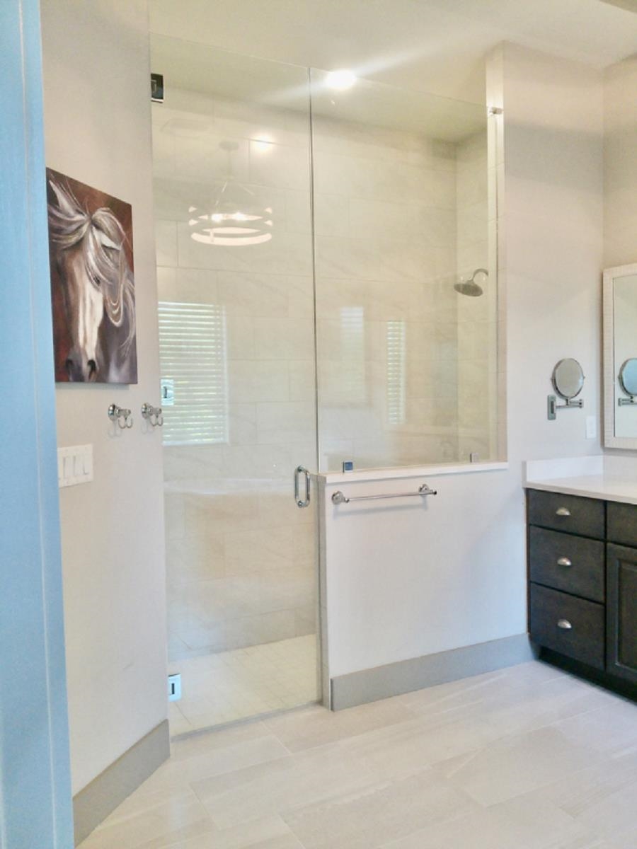 90 Nyes Place St. Augustine, FL 32092 - Photo 17 of 32 a bathroom with a shower a sink and a mirror