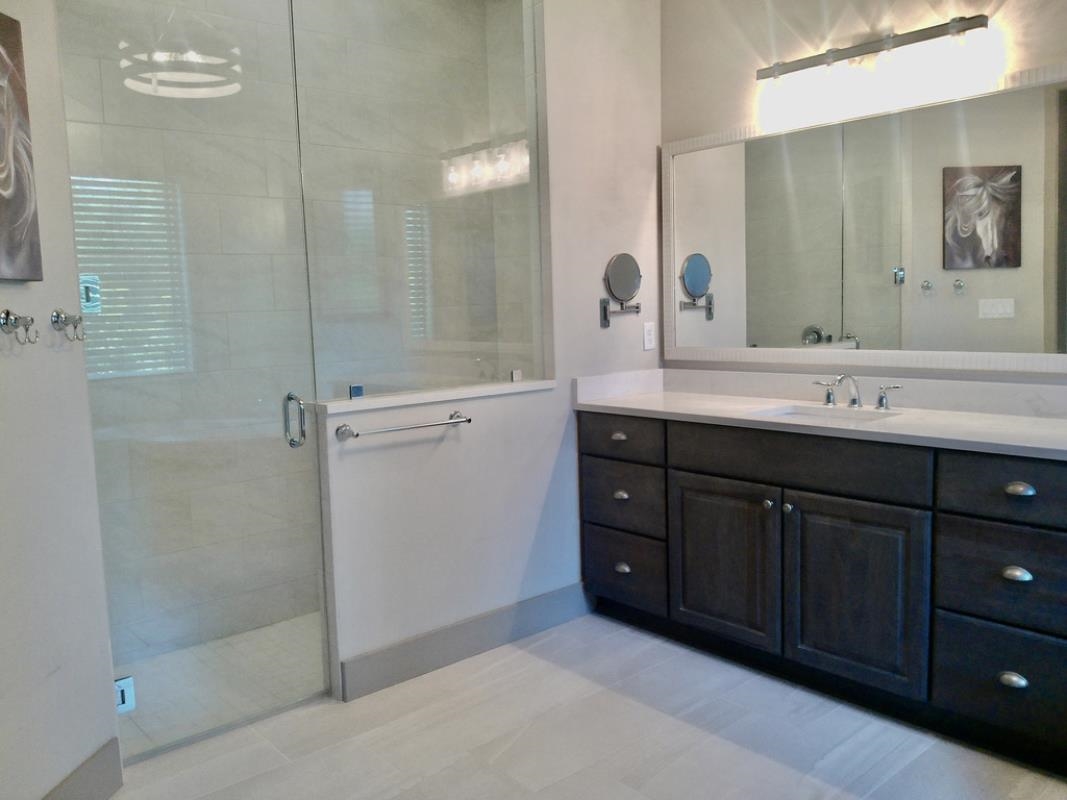 90 Nyes Place St. Augustine, FL 32092 - Photo 18 of 32 a bathroom with a double vanity sink mirror and shower