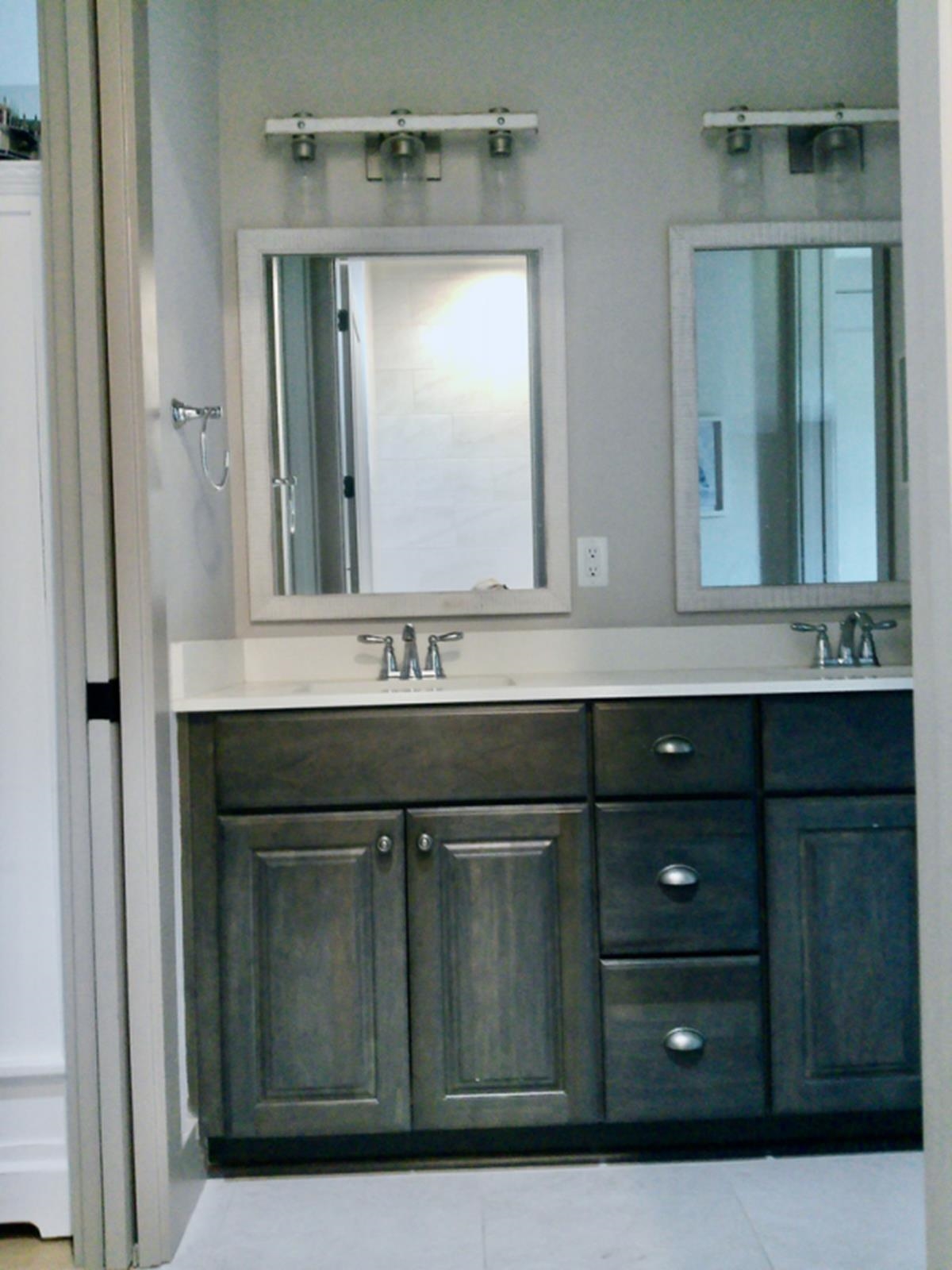 90 Nyes Place St. Augustine, FL 32092 - Photo 25 of 32 a bathroom with a sink vanity and mirror