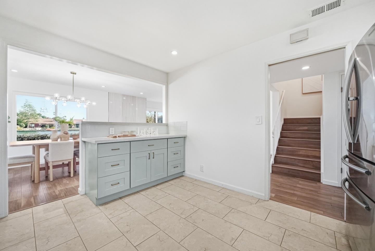 1157 Nimitz Lane Foster City, CA 94404 - Photo 13 of 69 a room with a chair and white cabinets