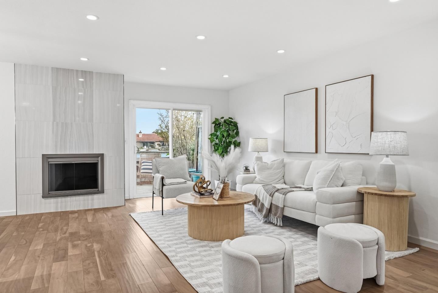 1157 Nimitz Lane Foster City, CA 94404 - Photo 2 of 69 a living room with furniture a fireplace and a table