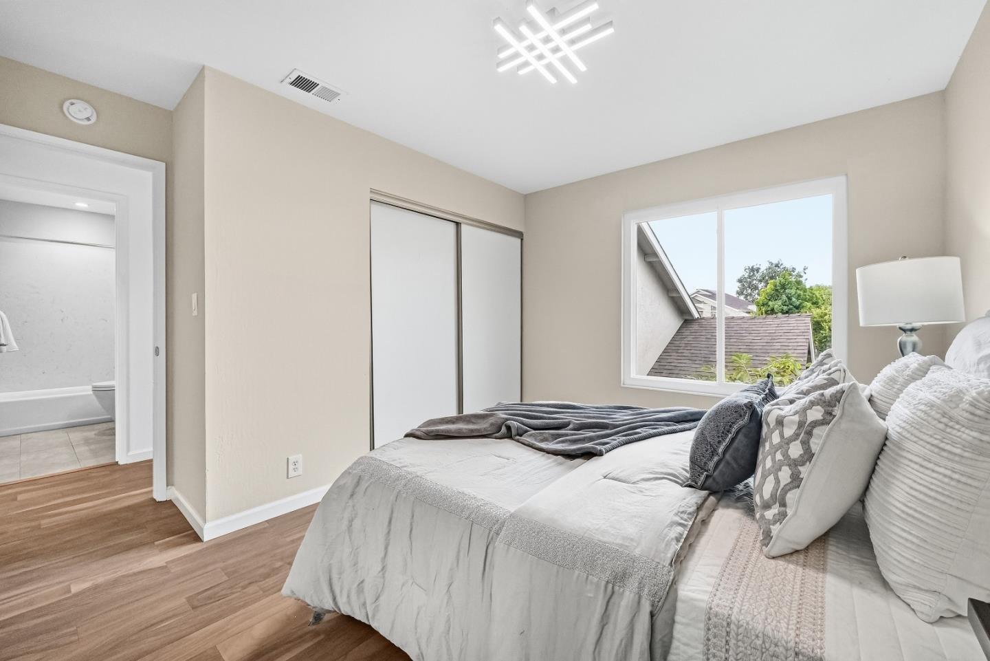 1157 Nimitz Lane Foster City, CA 94404 - Photo 22 of 69 a bedroom with a bed and wooden floor