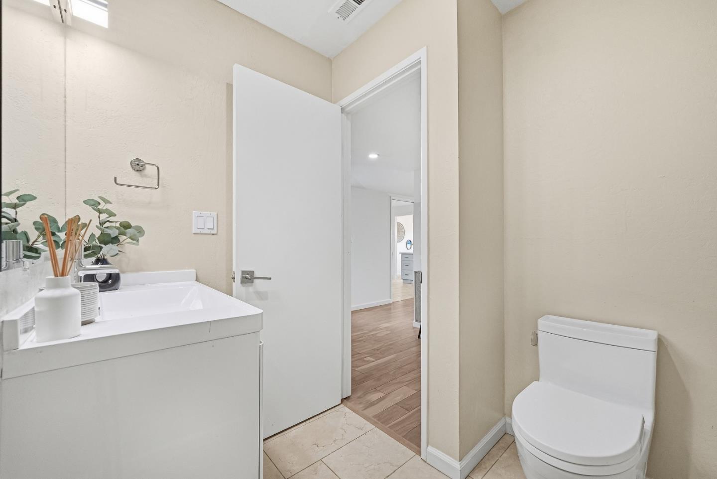 1157 Nimitz Lane Foster City, CA 94404 - Photo 28 of 69 a bathroom with a sink a toilet and shower