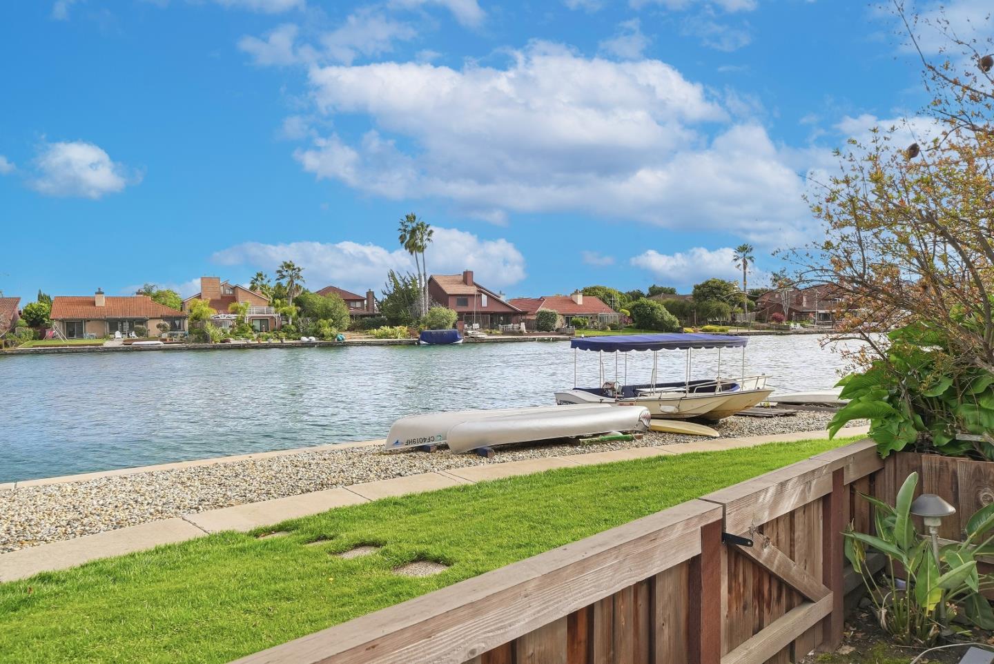 1157 Nimitz Lane Foster City, CA 94404 - Photo 37 of 69 a view of a lake with houses in the back