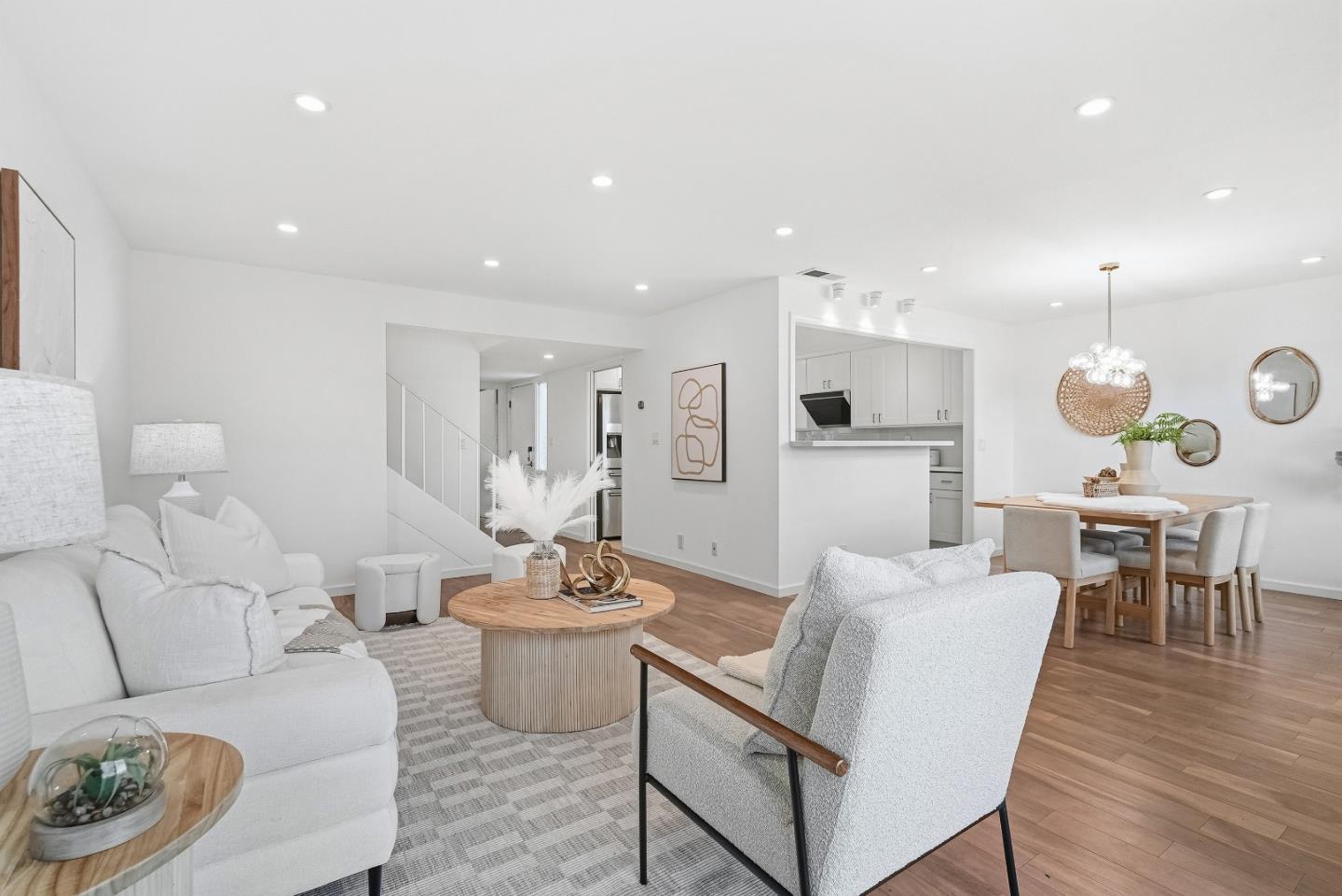 1157 Nimitz Lane Foster City, CA 94404 - Photo 5 of 69 a living room with furniture kitchen view and a wooden floor