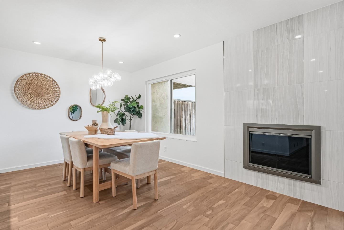 1157 Nimitz Lane Foster City, CA 94404 - Photo 6 of 69 a dining room with furniture a fireplace and wooden floor