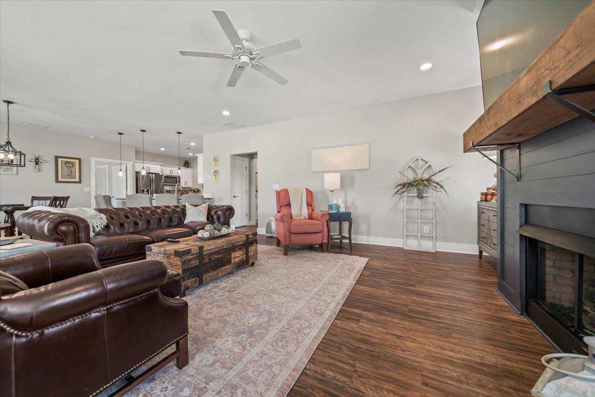 415 Abbey Road, Unit D Munford, TN 38058 - Photo 8 of 35 Living area featuring wood-finish flooring, a ceiling fan with integrated lighting, and recessed ceiling lights