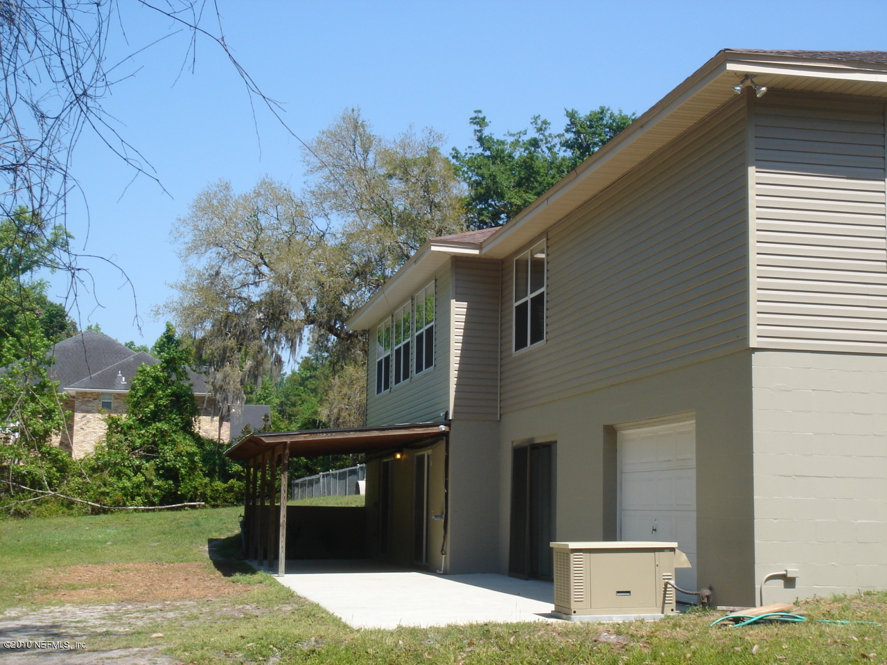 3472 Russell Road Green Cove Springs, FL 32043 - Photo 31 of 42 Covered back Patio and concrete area