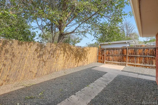 a view of backyard with large trees