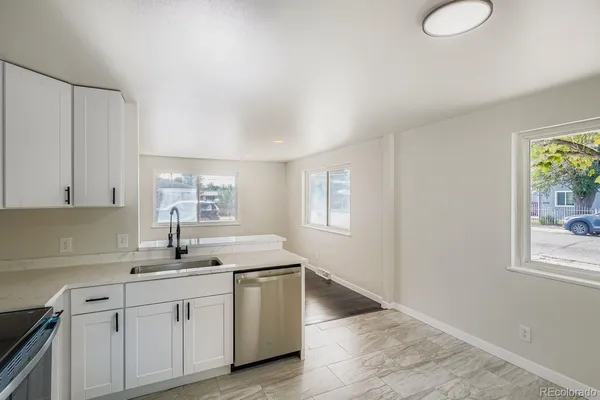 a kitchen with sink and window