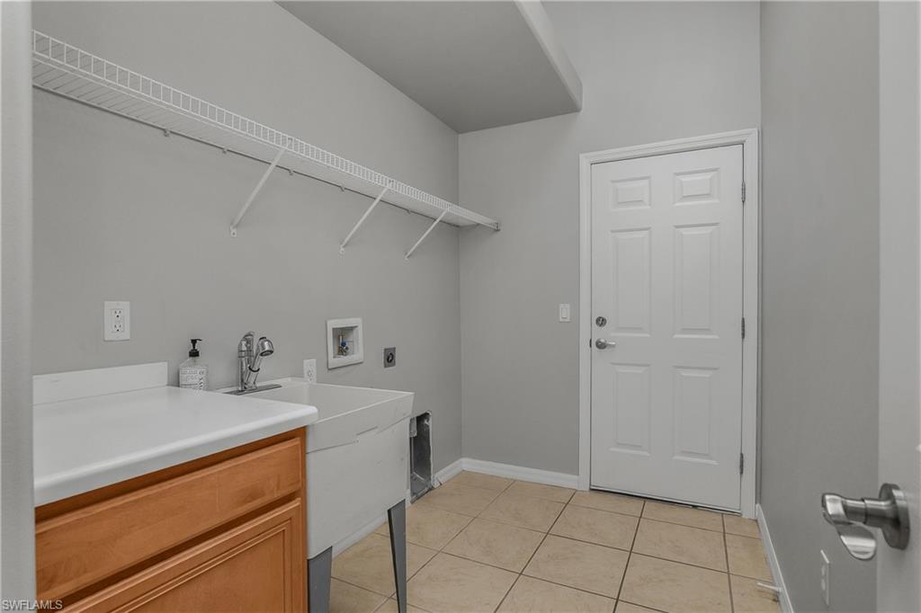 2022 Fairmont Lane Naples, FL 34120 - Photo 19 of 33 a view of a storage & utility room with two washing machine