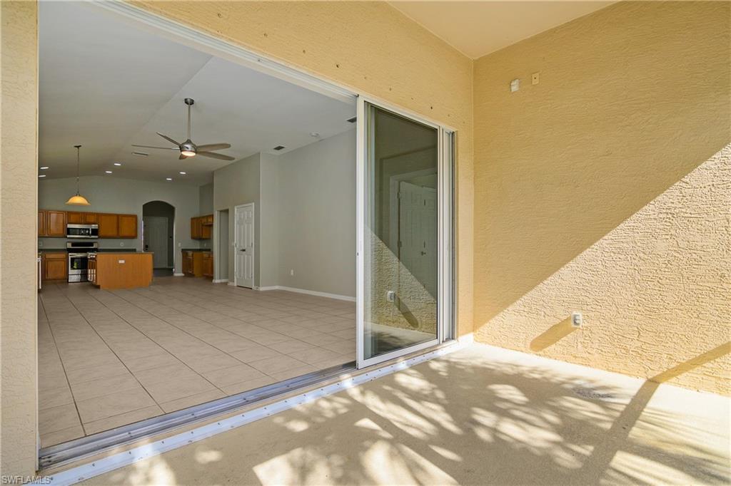 2022 Fairmont Lane Naples, FL 34120 - Photo 21 of 33 a view of a hallway with a large window
