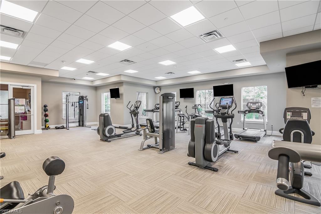 2022 Fairmont Lane Naples, FL 34120 - Photo 22 of 33 a view of a room with gym equipment
