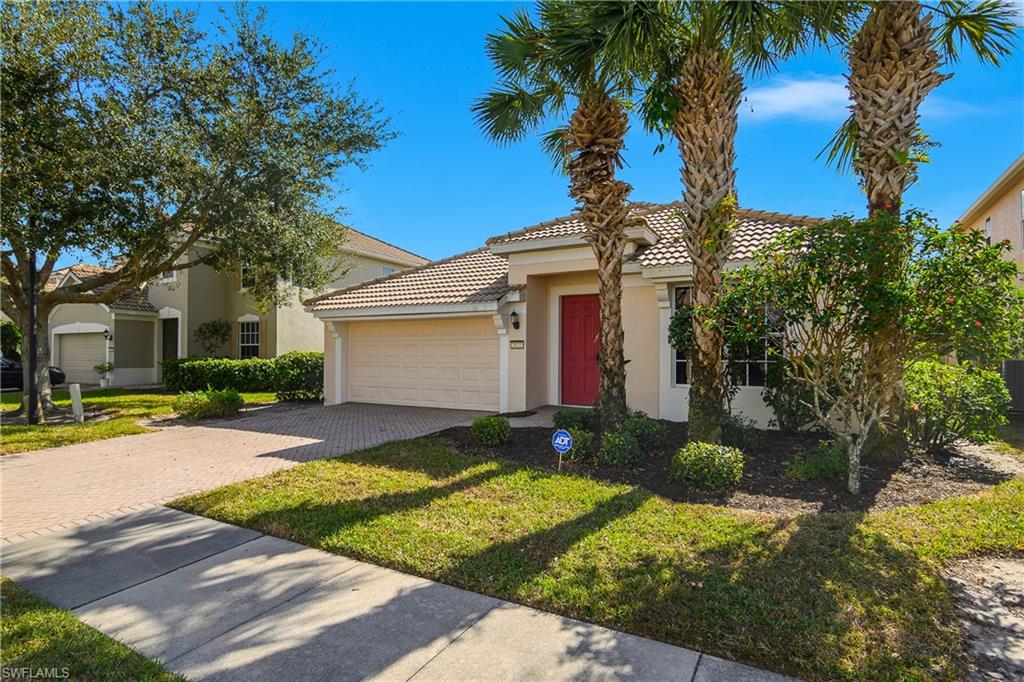 2022 Fairmont Lane Naples, FL 34120 - Photo 23 of 33 a view of a house with backyard and garden