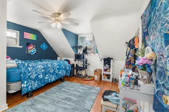 a bedroom with furniture and a lamp