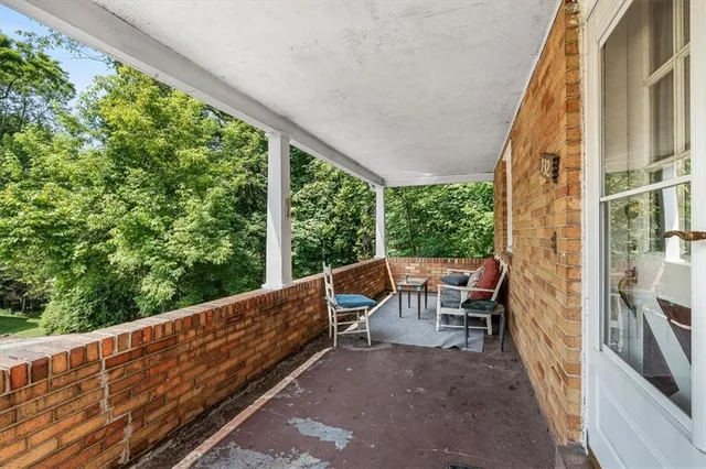 a view of balcony with furniture