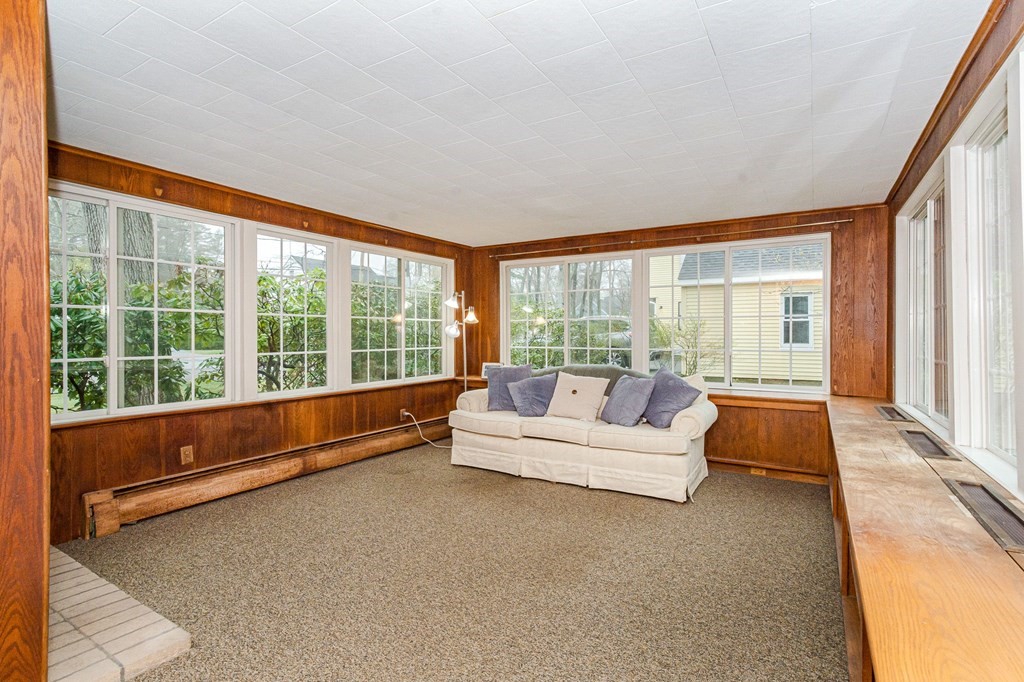50 Oak Ridge Road Reading, MA 01867 - Photo 15 of 36 a spacious bedroom with a bed and a large window