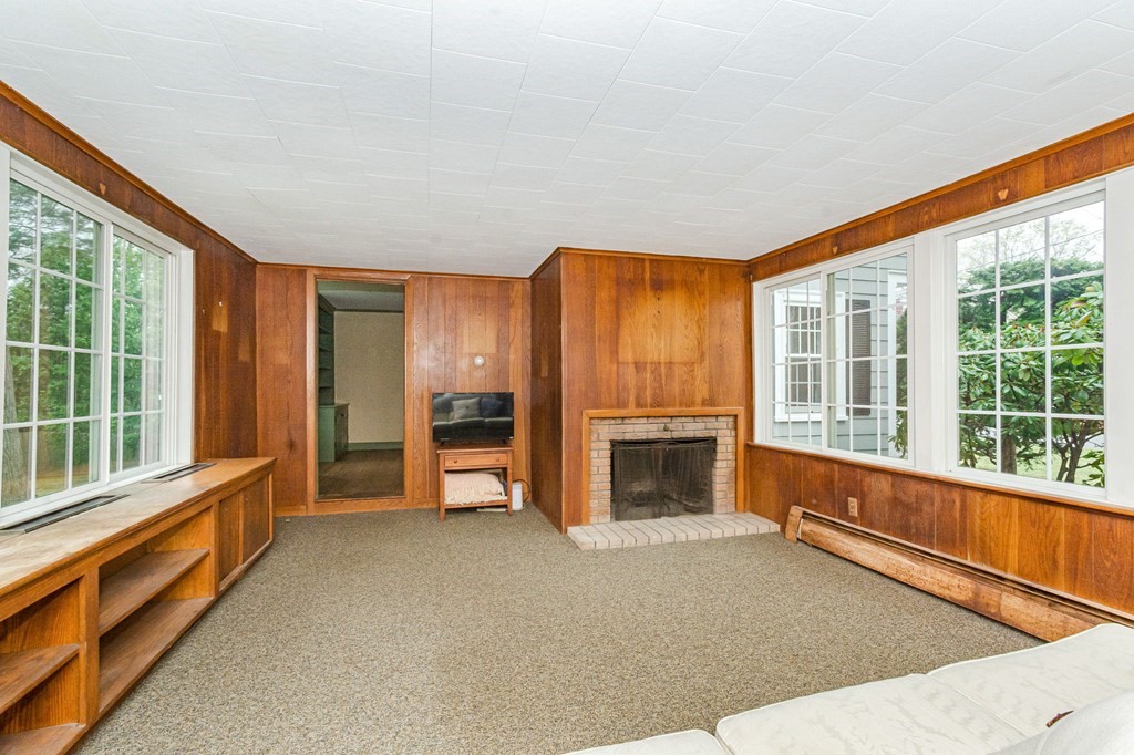 50 Oak Ridge Road Reading, MA 01867 - Photo 16 of 36 a view of empty room with floor to ceiling window and an outdoor view