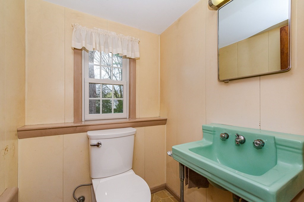 50 Oak Ridge Road Reading, MA 01867 - Photo 29 of 36 a bathroom with a toilet sink and mirror