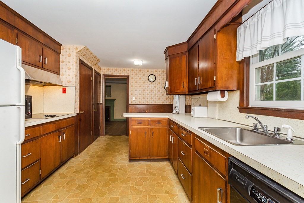 50 Oak Ridge Road Reading, MA 01867 - Photo 3 of 36 a large kitchen with a sink and dishwasher a oven with wooden cabinets