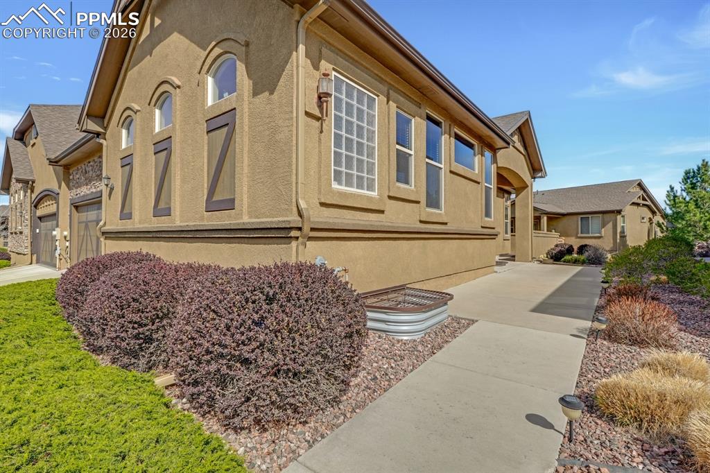 7636 Wichita Ridge Point Colorado Springs, CO 80923 - Photo 28 of 33 Side view of home