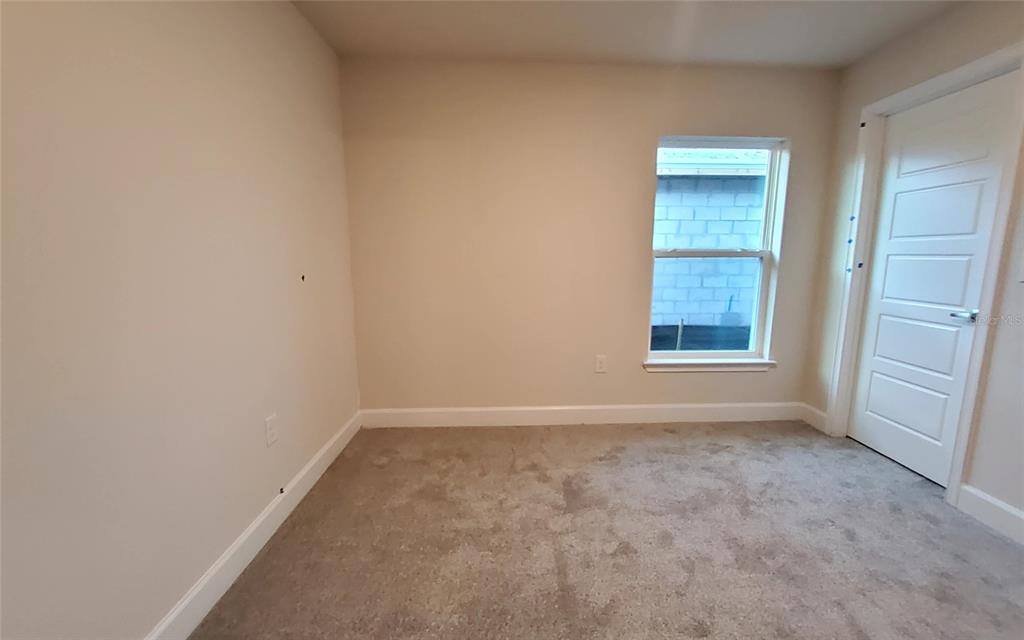 7576 Bent Tree Loop St. Cloud, FL 34773 - Photo 12 of 18 an empty room with windows