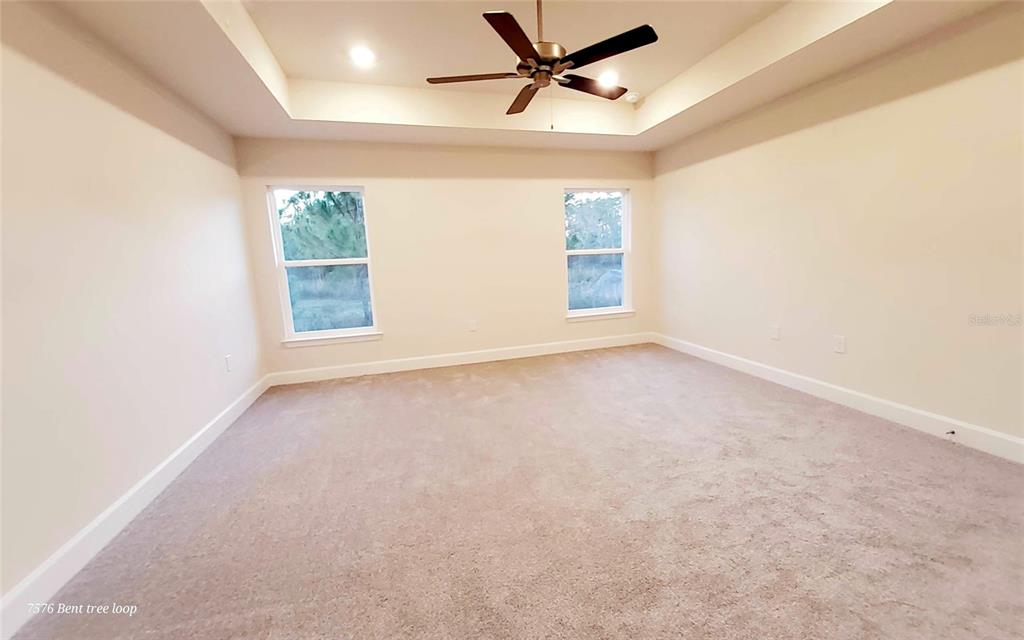 7576 Bent Tree Loop St. Cloud, FL 34773 - Photo 14 of 18 an empty room with a window