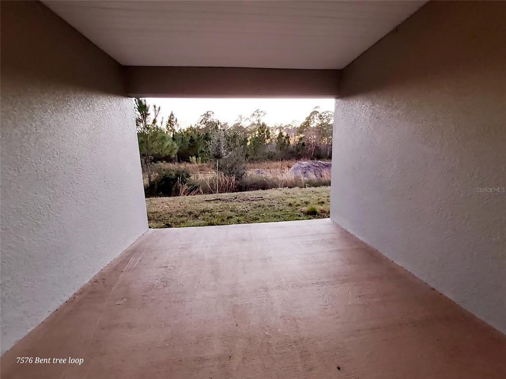 7576 Bent Tree Loop St. Cloud, FL 34773 - Photo 18 of 18 a view of a room with a yard