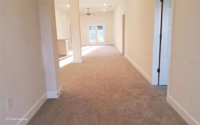 a view of a hallway with a bathroom