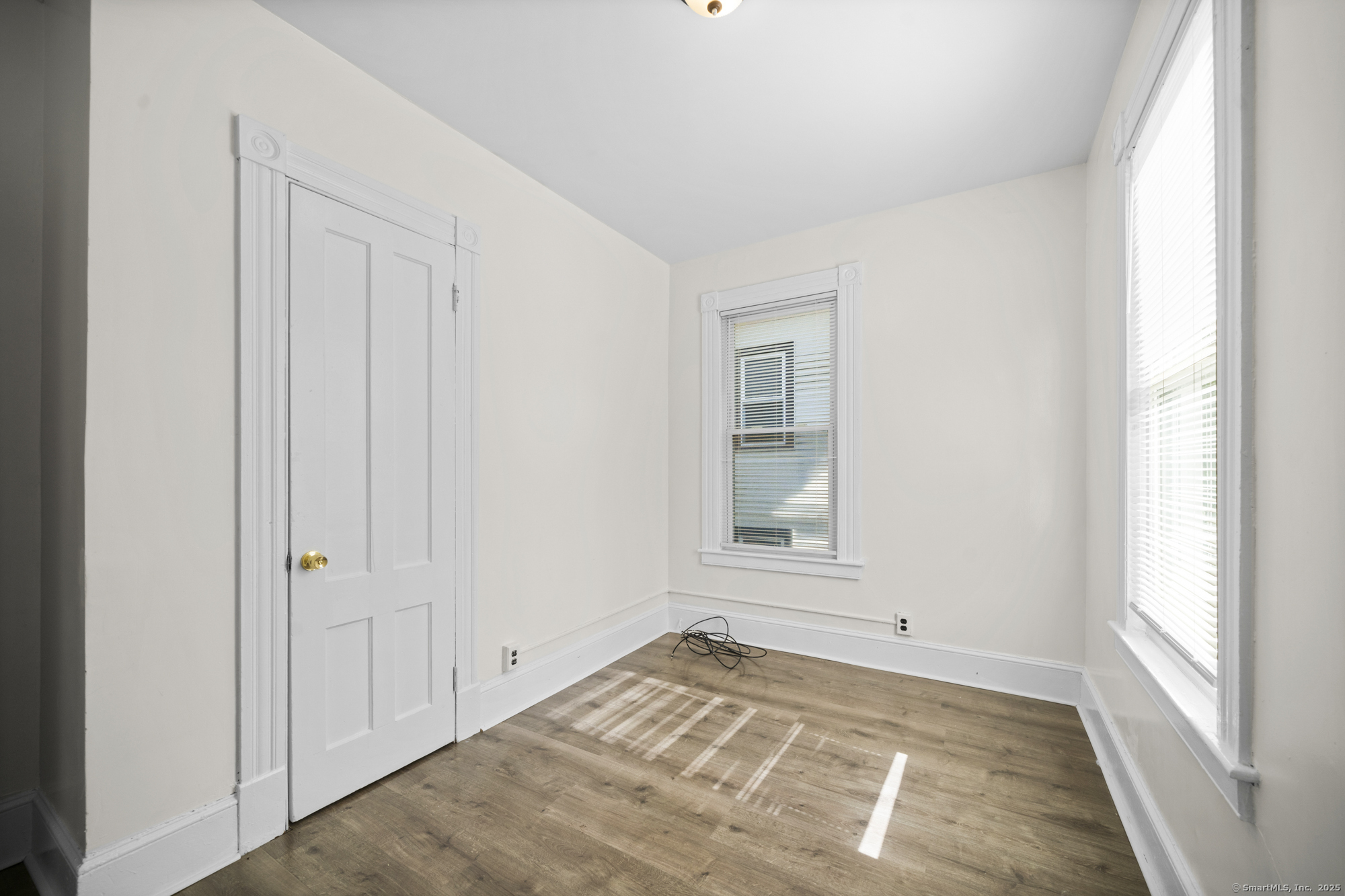 217 Woodlawn Terrace Waterbury, CT 06710 - Photo 9 of 9 an empty room with windows