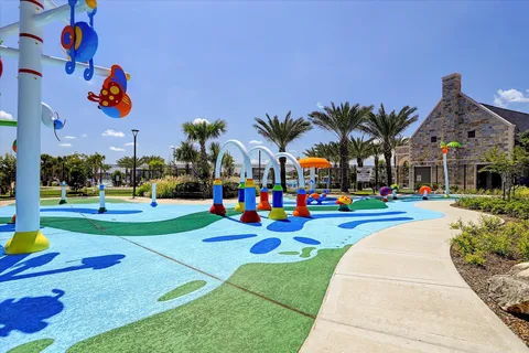 a childrens park with lots of swings and slides