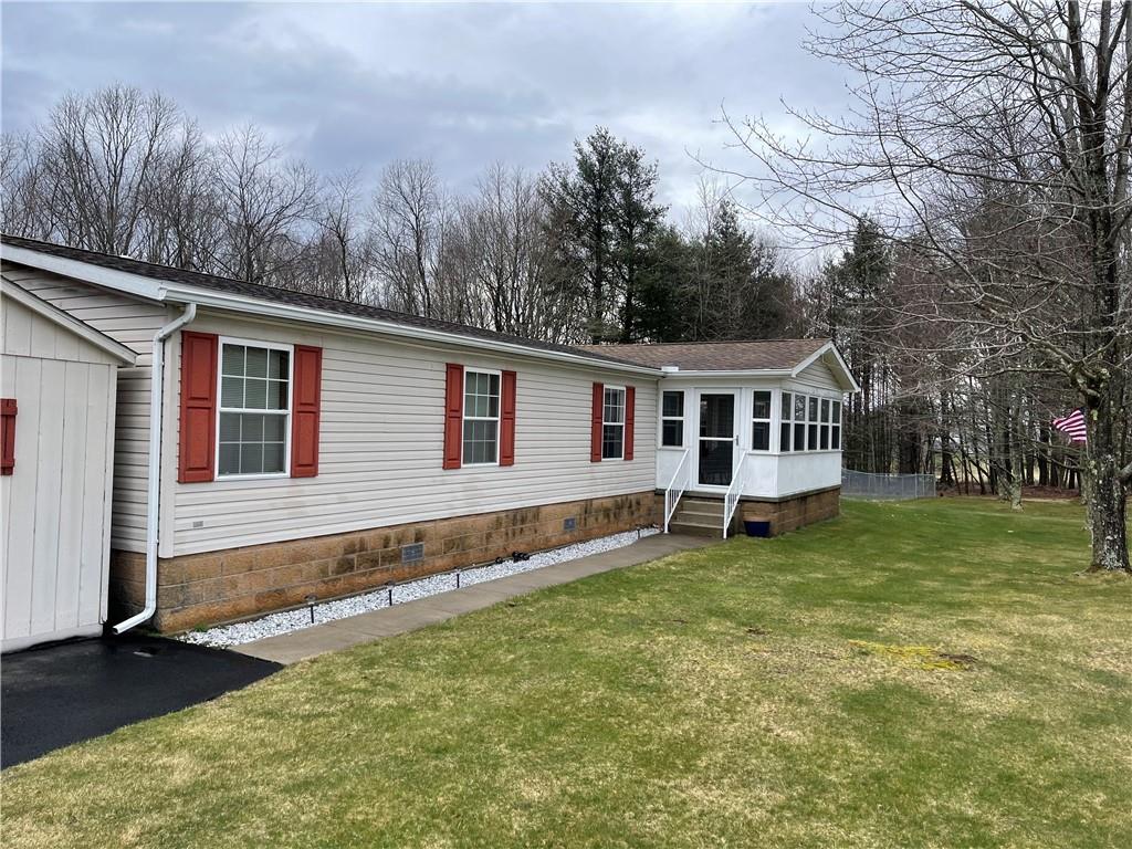 168 Big Rock Road Berlin, PA 15530 - Photo 1 of 25 a view of a house with a yard and a wooden deck