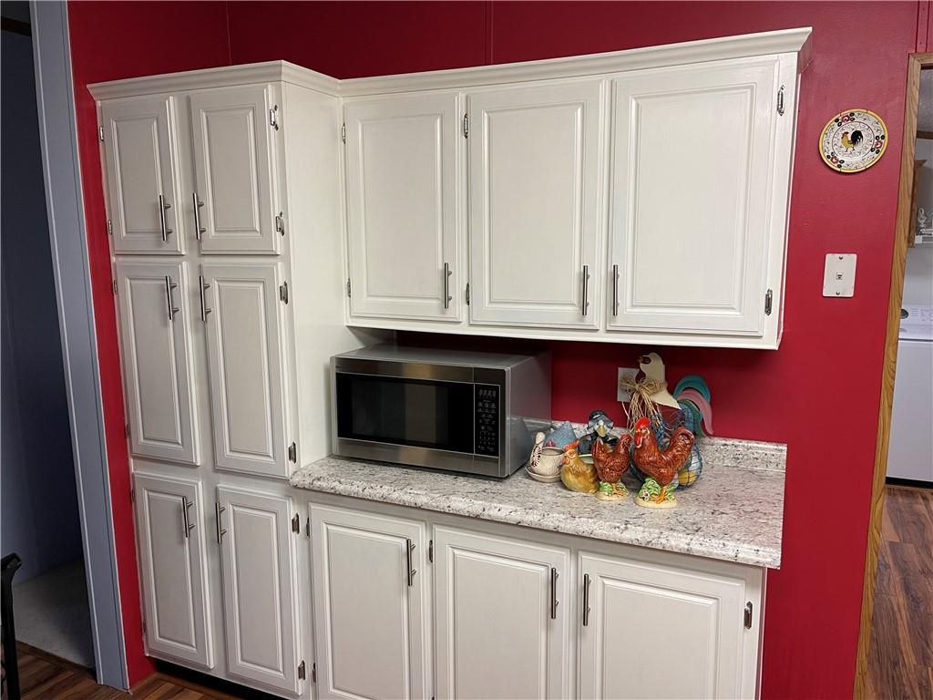 168 Big Rock Road Berlin, PA 15530 - Photo 11 of 25 a kitchen with stainless steel appliances granite countertop a refrigerator and cabinets