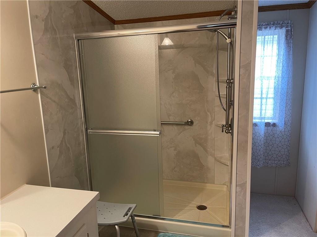 168 Big Rock Road Berlin, PA 15530 - Photo 16 of 25 a bathroom with a glass shower door